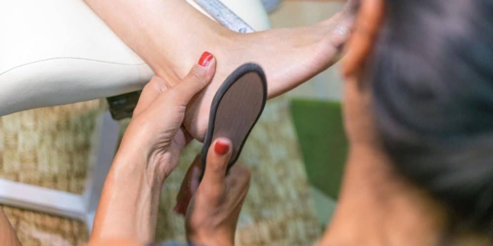 female-pedicure-care-feet-toenails-master-conducts-procedures-foot-care