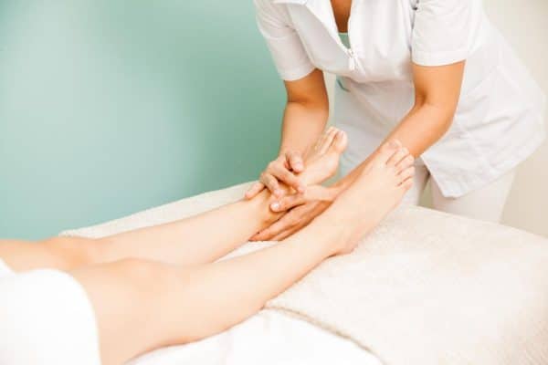 closeup-female-masseuse-giving-foot-massage-one-her-clients-health-beauty-spa