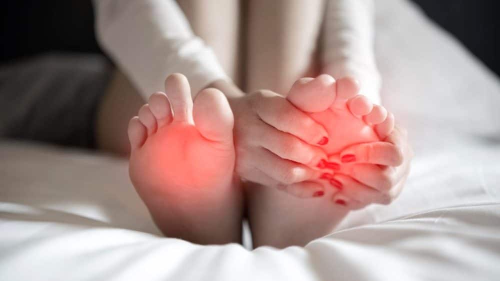 pain-foot-girl-holds-her-hands-her-feet-foot-massage