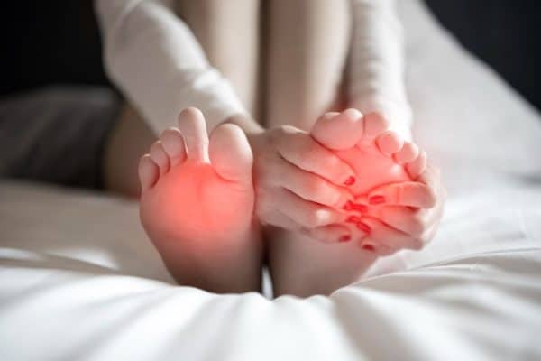 pain-foot-girl-holds-her-hands-her-feet-foot-massage